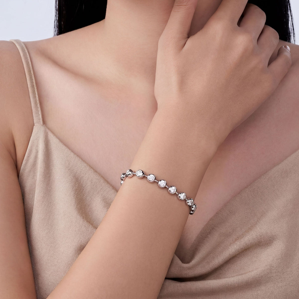 Bezel-set tennis bracelet, moissanite stones in 18K White Gold Vermeil