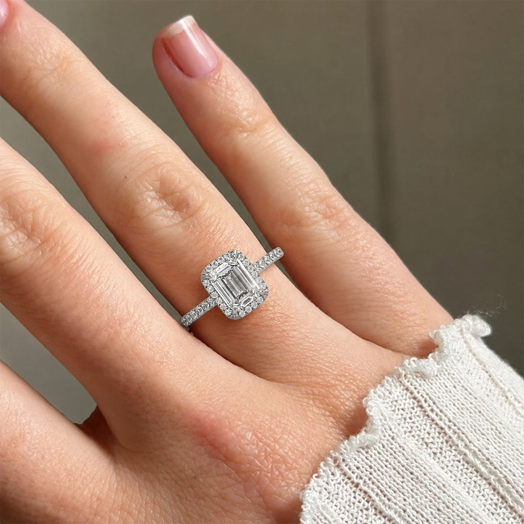 Emerald-cut halo engagement ring with pavé band, moissanite stones in 18K White Gold Vermeil