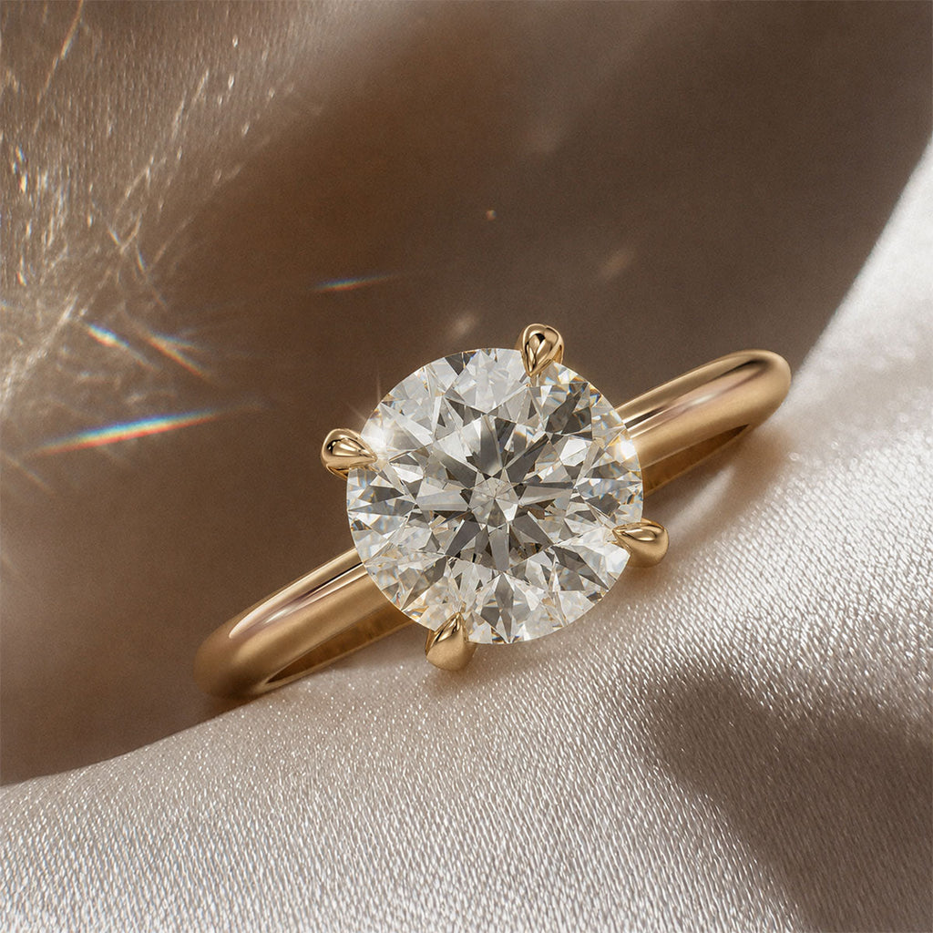 Four-prong round solitaire engagement ring, moissanite stone in 18K Yellow Gold Vermeil