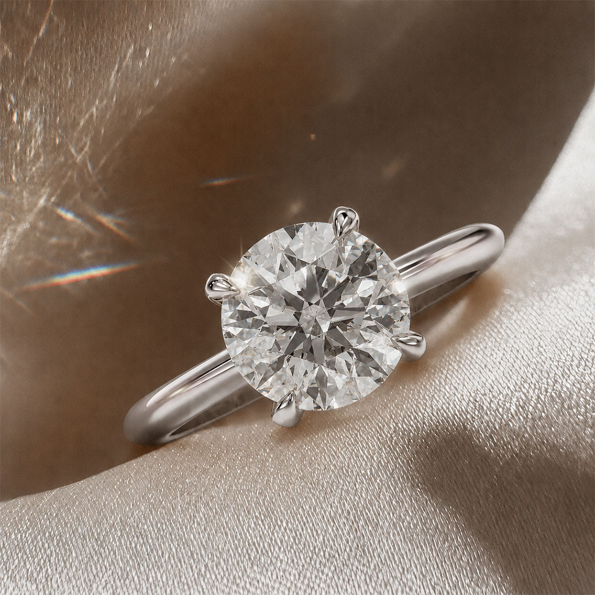 Four-prong round solitaire engagement ring, moissanite stone in 18K White Gold Vermeil