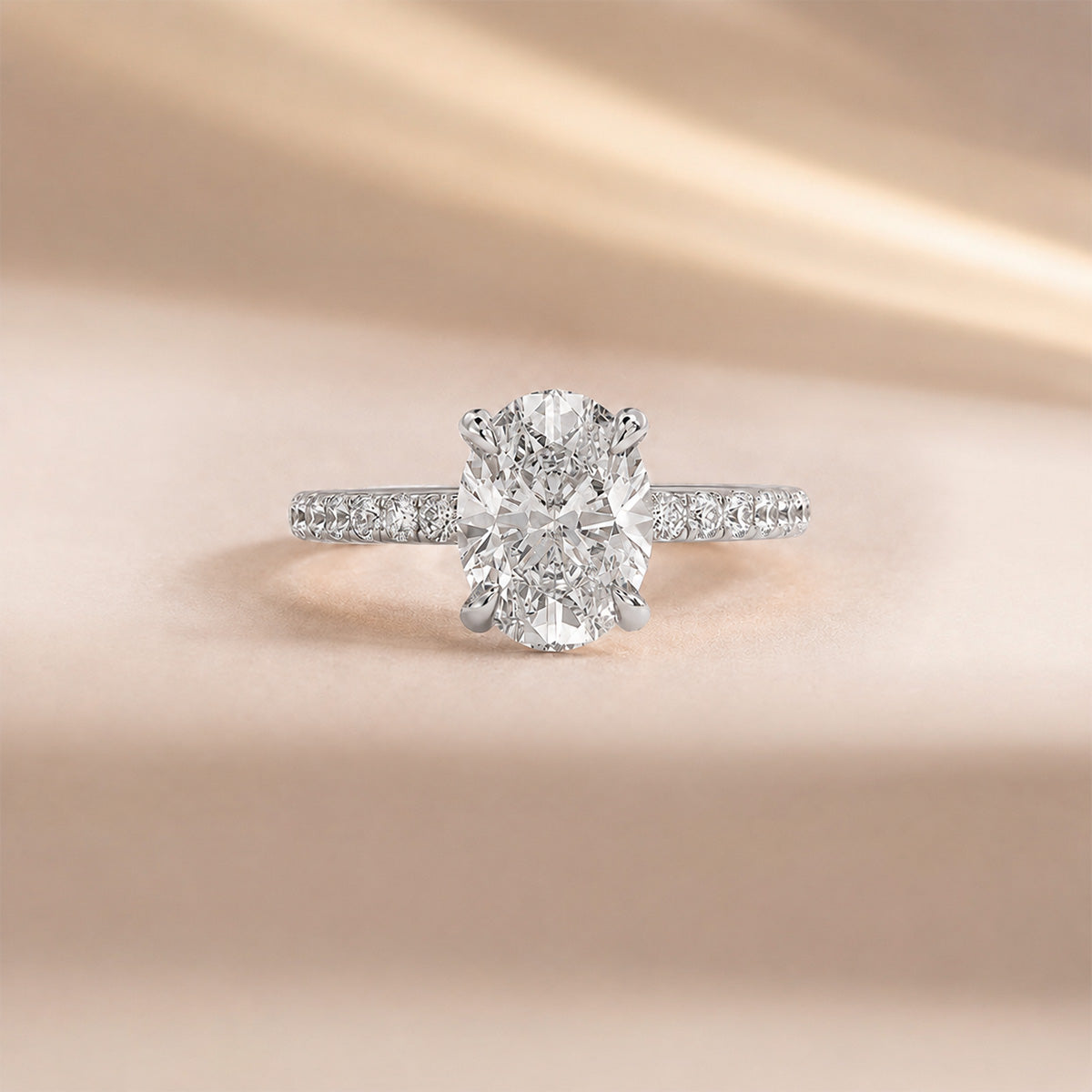 Oval hidden halo engagement ring with pavé band, moissanite stones in 18K White Gold Vermeil