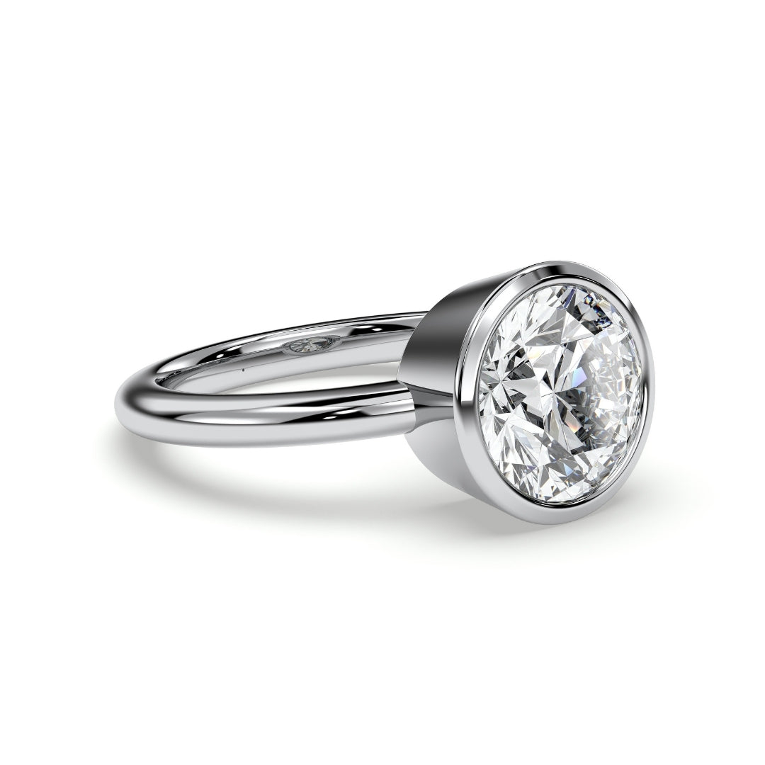 Round bezel-set solitaire engagement ring, moissanite stone in 18K White Gold Vermeil