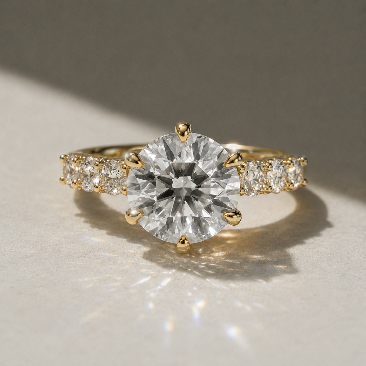 Round solitaire engagement ring with side stones, moissanite stones in 18K Yellow Gold Vermeil